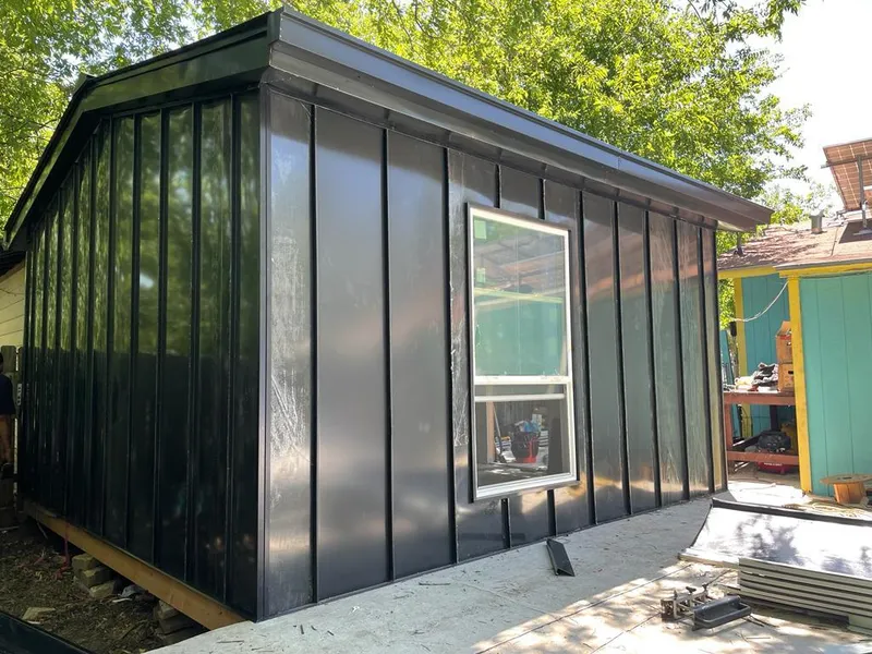 Black standing seam metal wall panels for Metal Roof Installation in Wellesley