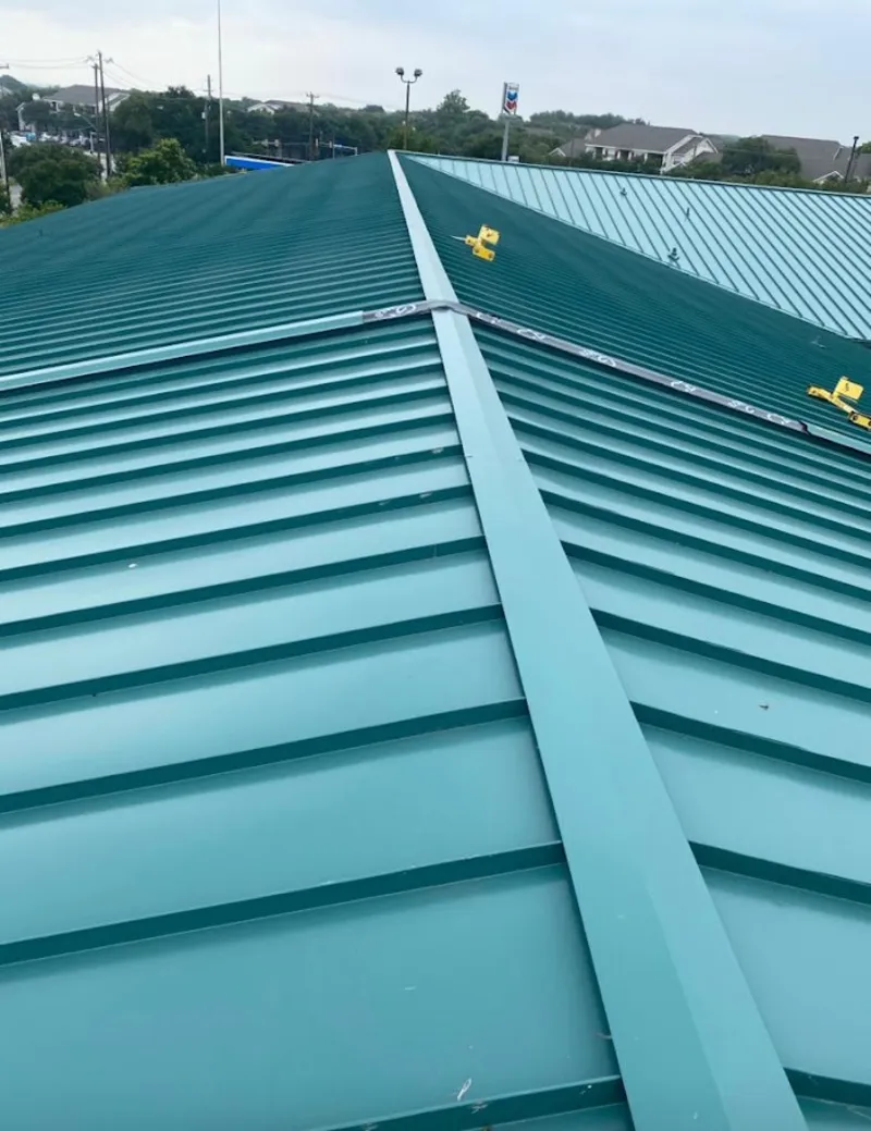 Green commercial metal roof ridge and valley for Metal Roof Repair in Wellesley