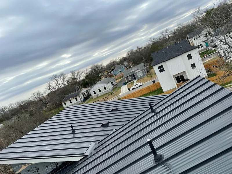 Standing seam metal roof panels with vents for Skylight Repair in Wellesley